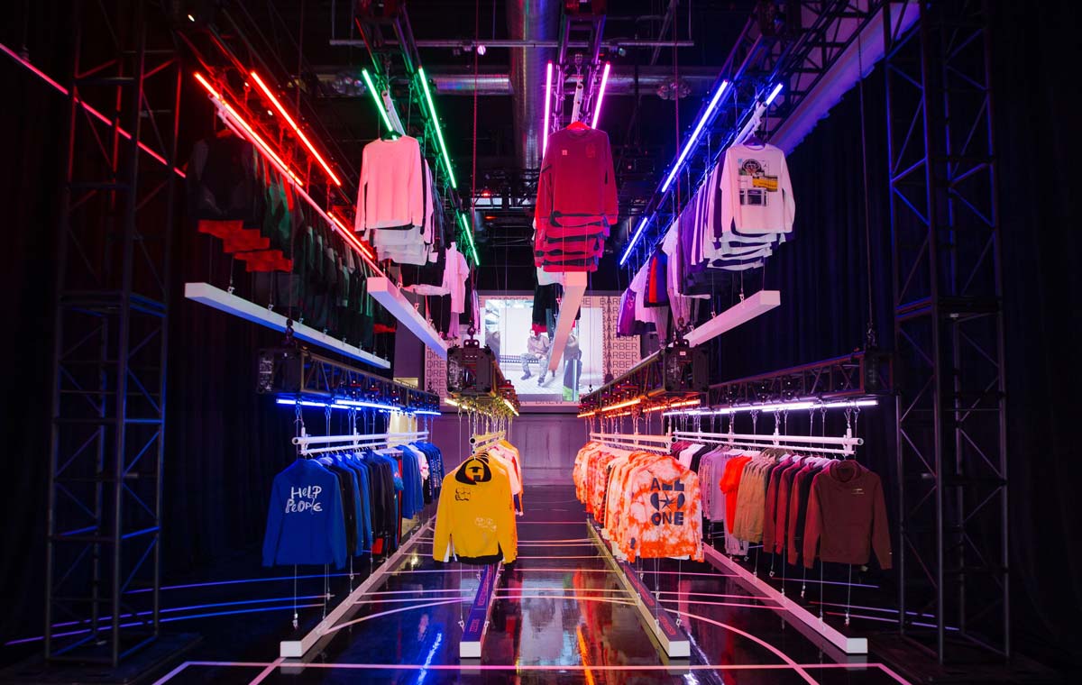 Custom fixtures for Nike's retail store include suspended racks and custom shelving