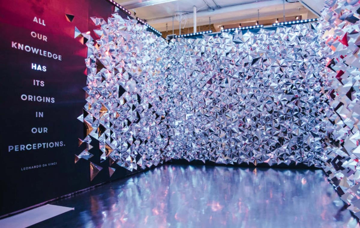 A experiential art installation at WNDR depicts an Art Installation vs an Exhibition Design