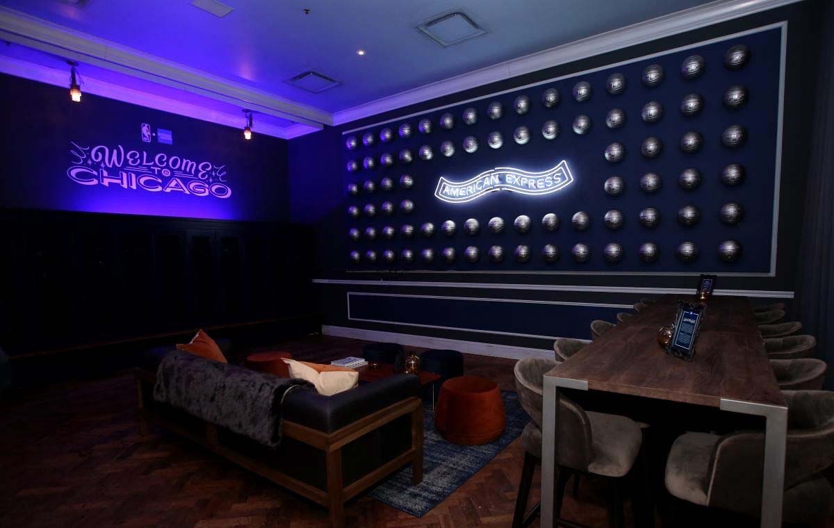 This purple lounge AmEx pop-up is an example of event branding