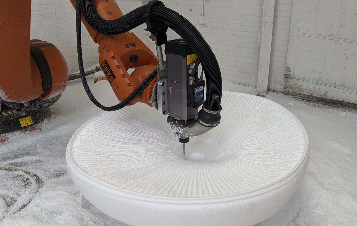 A precision cnc robotic router shapes a foam form into a mushroom