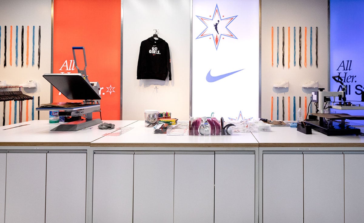 A Nike event pop up boosts brand affinity by allowing customers to create custom merchandise