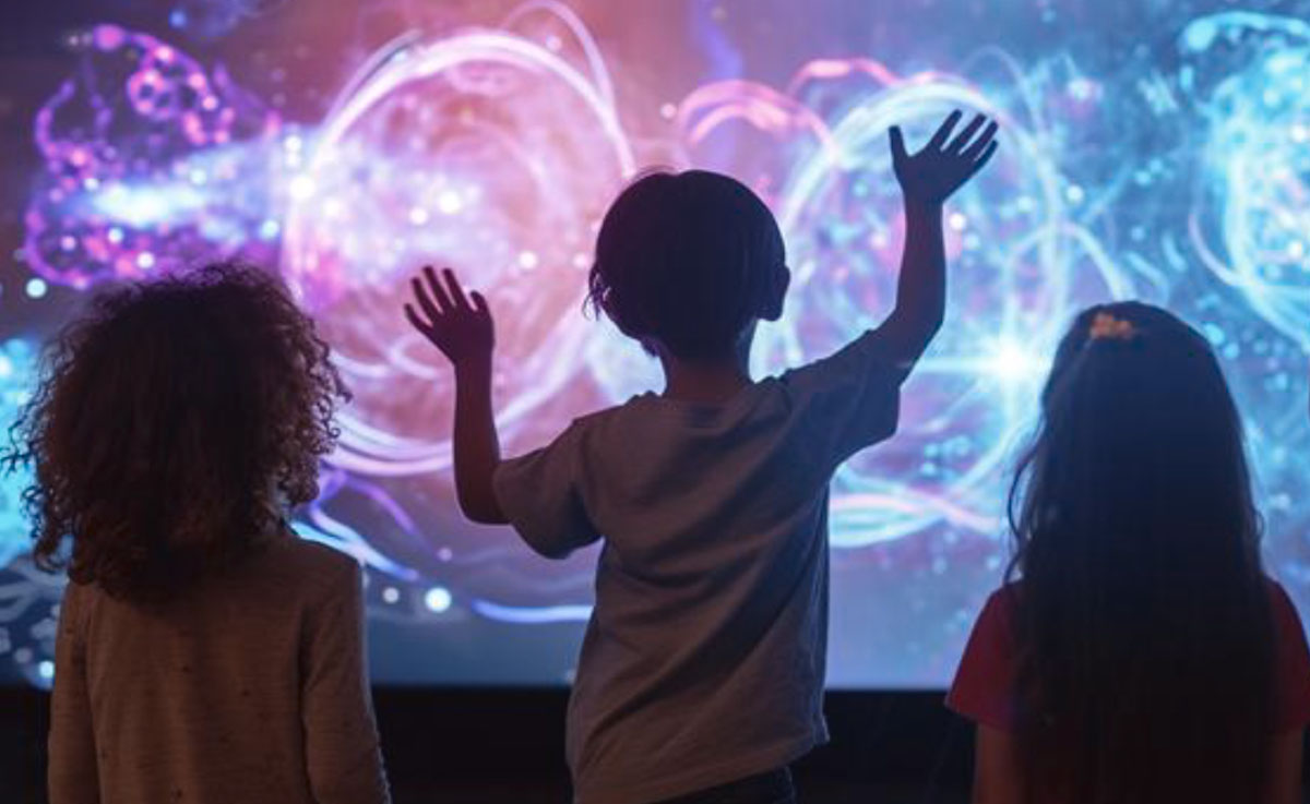 children interact with a dynamic digital kiosk in a retail store